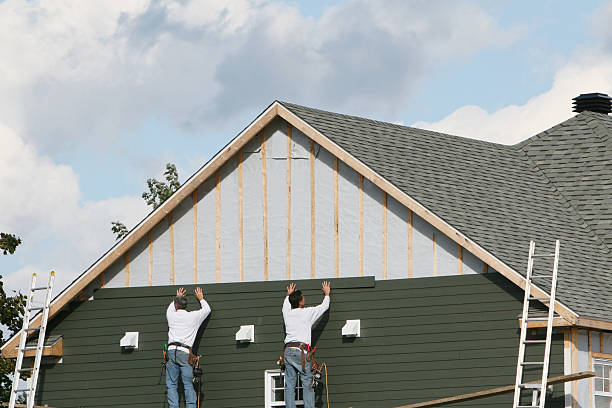 Professional Vinyl Siding technician working in Newton Center, MA